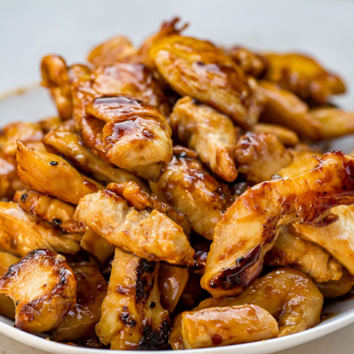 Blackstone chicken teriyaki with sauce, served with rice.