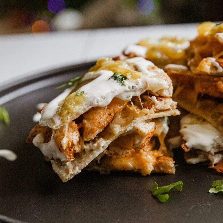 Blackstone Mexican chicken pizza sliced into quarters.