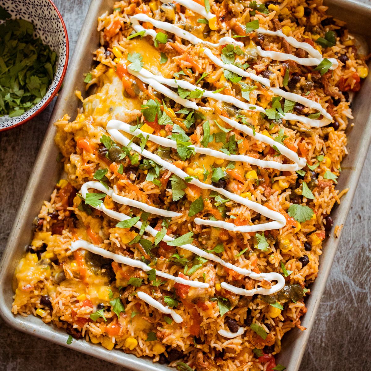Blackstone Mexican fried rice topped with melted cheese.
