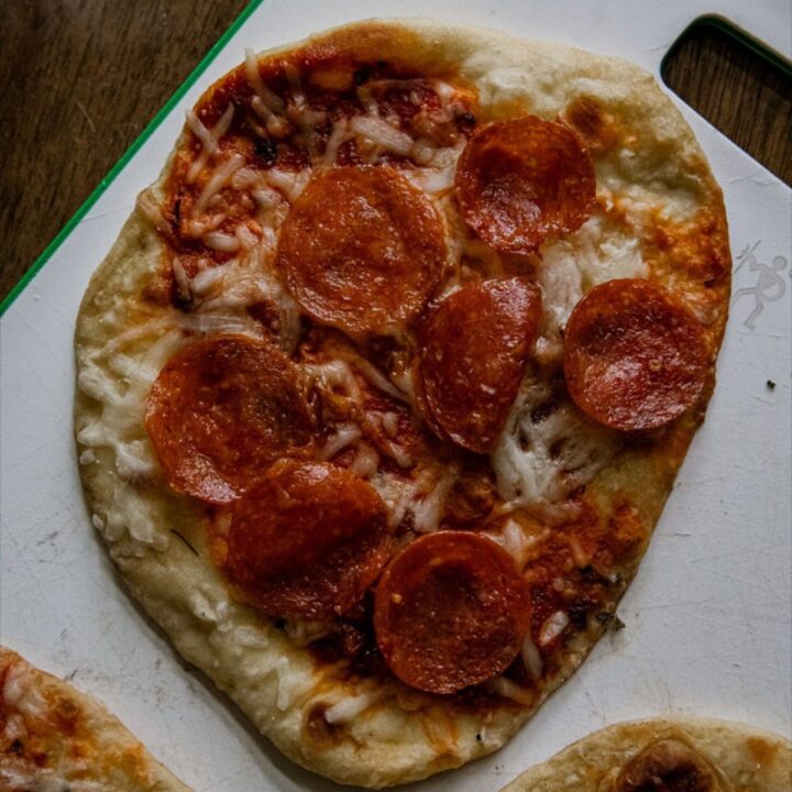 Blackstone pizza with melted cheese and toppings.