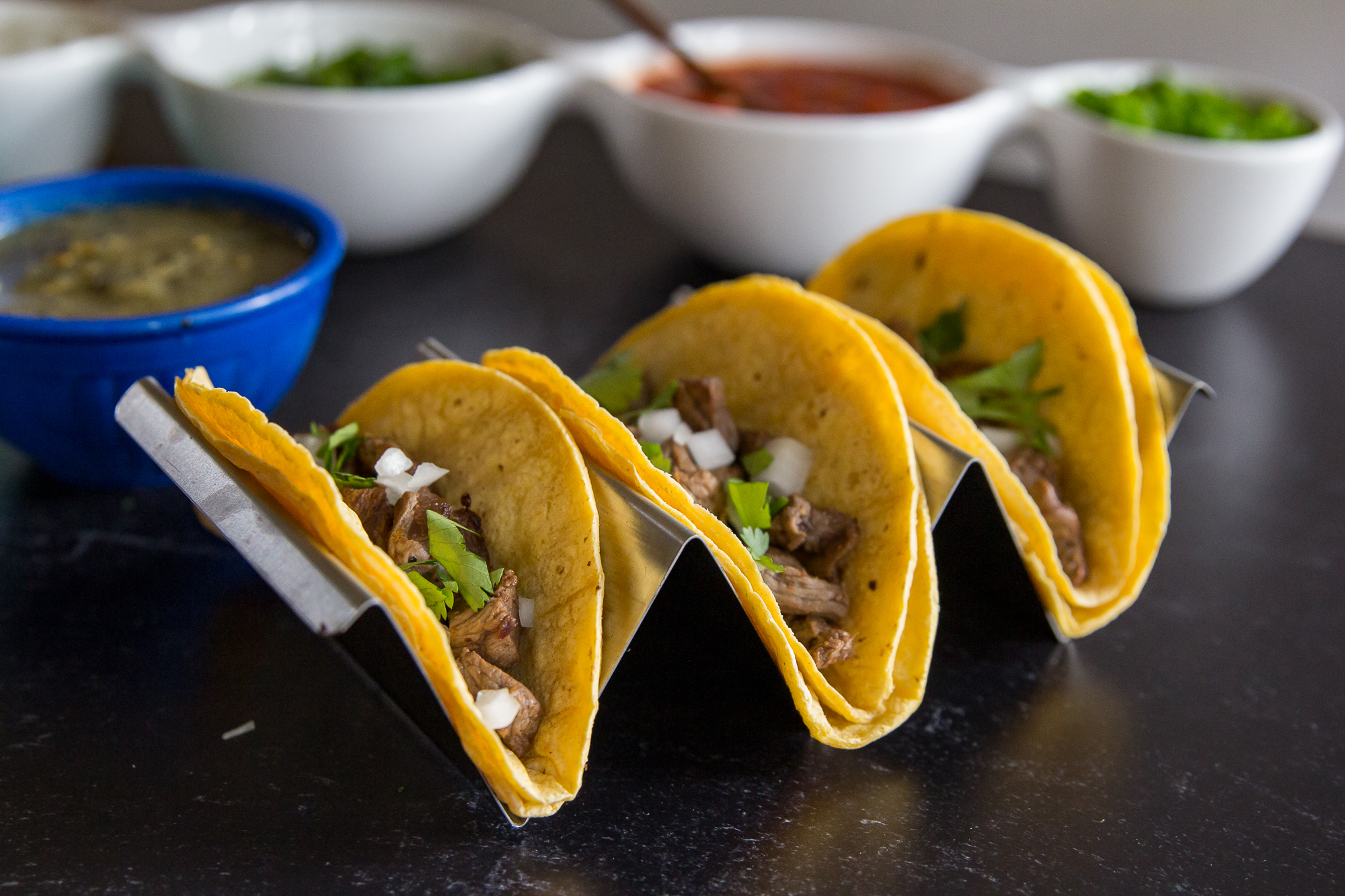 Blackstone skirt steak street tacos with onion and cilantro.