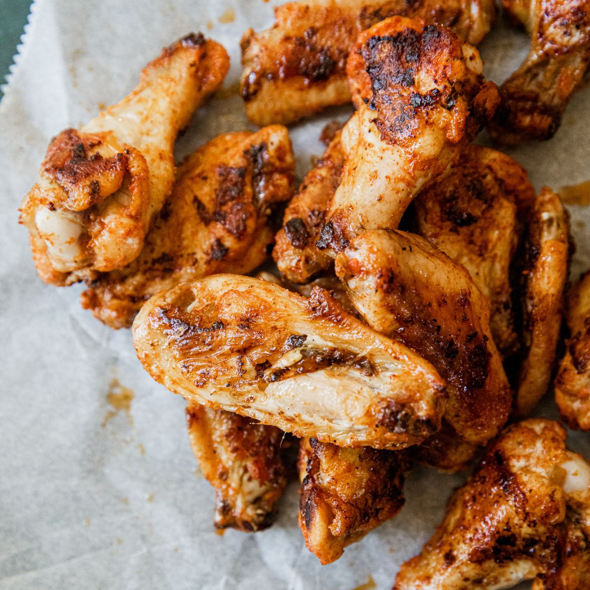 Crispy chicken wings cooked on a Blackstone griddle.
