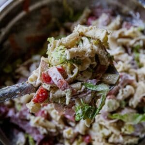 Close-up of Italian grinder pasta salad with vegetables and creamy dressing.