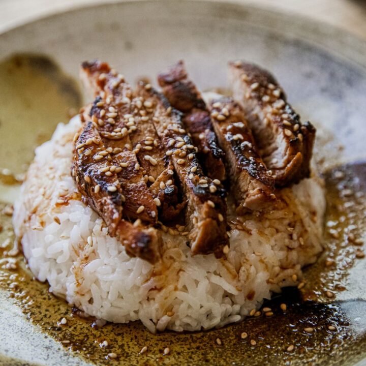 Blackstone pork tenderloin teriyaki medallions with sesame seeds.